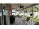 Relaxing screened porch, perfect for outdoor dining at 1743 Arabian Ln, Palm Harbor, FL 34685