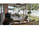 Spacious screened porch with seating and a grill at 1743 Arabian Ln, Palm Harbor, FL 34685