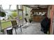 Outdoor patio with tiki bar and seating area at 1743 Arabian Ln, Palm Harbor, FL 34685