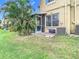 Private backyard with screened patio and lush landscaping at 17523 Stinchar Dr # 17523, Land O Lakes, FL 34638