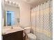 Clean bathroom with single sink vanity, shower, and toilet at 17523 Stinchar Dr # 17523, Land O Lakes, FL 34638
