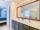 Double vanity bathroom with a view into bedroom at 17523 Stinchar Dr # 17523, Land O Lakes, FL 34638