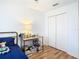 Cozy bedroom featuring a twin bed, desk, and spacious closet at 17523 Stinchar Dr # 17523, Land O Lakes, FL 34638