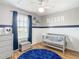 Charming Bedroom with crib, dresser, and playful decor at 17523 Stinchar Dr # 17523, Land O Lakes, FL 34638
