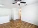 Bright bedroom with wood floors and access to bathroom at 17523 Stinchar Dr # 17523, Land O Lakes, FL 34638