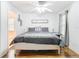 Bright bedroom with a queen-size bed and wood floors at 17523 Stinchar Dr # 17523, Land O Lakes, FL 34638