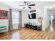 Spacious bedroom with wood floors and a TV at 17523 Stinchar Dr # 17523, Land O Lakes, FL 34638
