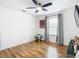 Bedroom with wood floors, window with gray curtains at 17523 Stinchar Dr # 17523, Land O Lakes, FL 34638