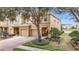 Two-story house with a two-car garage and a view of a lake at 17523 Stinchar Dr # 17523, Land O Lakes, FL 34638