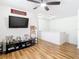Game room with baseball decor and a large TV at 17523 Stinchar Dr # 17523, Land O Lakes, FL 34638