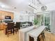 Open kitchen features island, stainless steel appliances, and light wood cabinets at 17523 Stinchar Dr # 17523, Land O Lakes, FL 34638