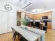 Open concept kitchen and dining area with an island and stainless steel appliances at 17523 Stinchar Dr # 17523, Land O Lakes, FL 34638