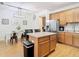 Eat-in kitchen with island and wood flooring at 17523 Stinchar Dr # 17523, Land O Lakes, FL 34638