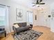 Living room with gray sofa, patterned rug, and ceiling fan at 17523 Stinchar Dr # 17523, Land O Lakes, FL 34638