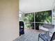 Enjoy this screened patio with a grill and pond view at 17523 Stinchar Dr # 17523, Land O Lakes, FL 34638
