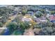 Aerial view showcasing home, pool, and surrounding neighborhood at 195 Rusk Cir, Spring Hill, FL 34606