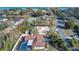 Aerial view of a house with pool, located in a quiet residential neighborhood at 195 Rusk Cir, Spring Hill, FL 34606