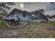 Landscaped backyard with pool and shed at 195 Rusk Cir, Spring Hill, FL 34606