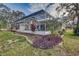 Screened pool and lush landscaping at 195 Rusk Cir, Spring Hill, FL 34606