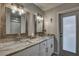 Double vanity bathroom with granite countertop and modern fixtures at 195 Rusk Cir, Spring Hill, FL 34606