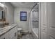 Bathroom with granite countertop, single vanity, and tub at 195 Rusk Cir, Spring Hill, FL 34606
