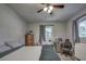 Bedroom with a queen bed, ceiling fan, and window at 195 Rusk Cir, Spring Hill, FL 34606