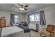 Bright bedroom with a queen bed and window seating at 195 Rusk Cir, Spring Hill, FL 34606