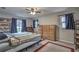 Main bedroom with a dresser, ceiling fan, and sliding door to backyard at 195 Rusk Cir, Spring Hill, FL 34606