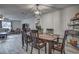 Charming dining area with a wooden table, six chairs, and a stylish light fixture at 195 Rusk Cir, Spring Hill, FL 34606