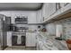Updated kitchen featuring granite countertops and stainless steel appliances at 195 Rusk Cir, Spring Hill, FL 34606