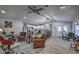 Open living room featuring hardwood floors, a ceiling fan, and comfortable seating at 195 Rusk Cir, Spring Hill, FL 34606