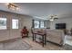 Spacious living area with comfortable seating, large windows, and a ceiling fan at 195 Rusk Cir, Spring Hill, FL 34606