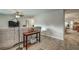 Relaxing living room featuring a sectional sofa, large windows, and tile flooring at 195 Rusk Cir, Spring Hill, FL 34606