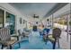 Covered patio with ceiling fan and comfortable seating at 195 Rusk Cir, Spring Hill, FL 34606