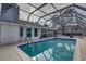 Sparkling, screened pool ready for summer fun at 195 Rusk Cir, Spring Hill, FL 34606