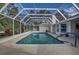 Inviting screened pool with ample space for relaxation at 195 Rusk Cir, Spring Hill, FL 34606