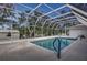 Inviting screened pool area, perfect for relaxation at 195 Rusk Cir, Spring Hill, FL 34606