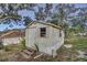 White storage shed with wood steps at 195 Rusk Cir, Spring Hill, FL 34606