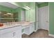 Double vanity bathroom with granite countertops and large mirror at 20011 Umbria Hill Dr, Tampa, FL 33647