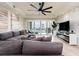 Living room boasts a sectional sofa,waterfront view, and modern decor at 202 Windward Psge # 208, Clearwater Beach, FL 33767