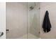 Clean and modern walk-in shower with hexagon tile floor at 2556 Pine Cove Ln, Clearwater, FL 33761