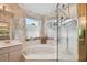 Bathroom with corner bathtub, shower, and vanity at 326 Caloosa Woods Ln, Sun City Center, FL 33573
