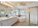 Spacious bathroom with a large soaking tub, double vanity, and a separate shower at 326 Caloosa Woods Ln, Sun City Center, FL 33573