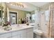 Clean bathroom with shower/tub combo and vanity at 326 Caloosa Woods Ln, Sun City Center, FL 33573