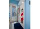 Bathroom with shower and nautical-themed decor at 3363 Cedar Crest Loop, Spring Hill, FL 34609