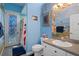 Bright bathroom with a nautical theme and shower at 3363 Cedar Crest Loop, Spring Hill, FL 34609