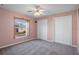 Well-lit bedroom with double closets and a window overlooking the backyard at 3363 Cedar Crest Loop, Spring Hill, FL 34609