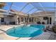 Resort-style pool with spacious deck and screened enclosure at 3363 Cedar Crest Loop, Spring Hill, FL 34609