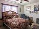 Spacious bedroom with a large bed and ceiling fan at 4415 Great Lakes N Dr, Clearwater, FL 33762