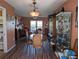 Dining room with wood table and chairs, hardwood floor, and display cabinet at 4415 Great Lakes N Dr, Clearwater, FL 33762